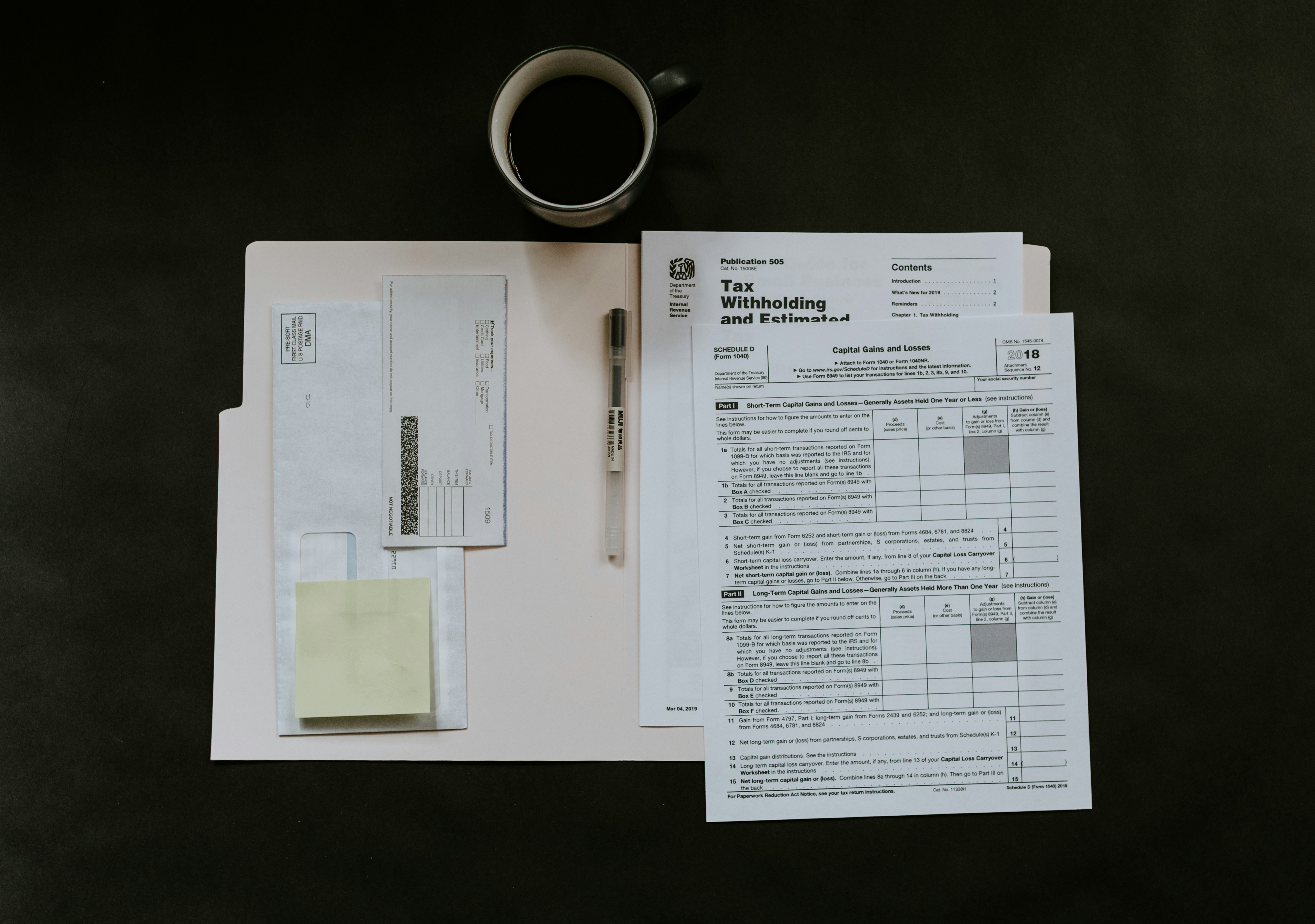 Tax forms and paperwork with coffee